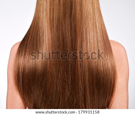 Rear view  of the woman with long  hair - studio