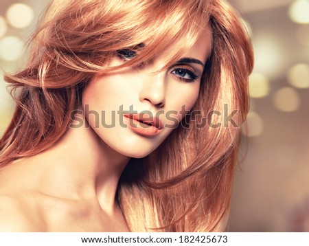 Portrait of a beautiful woman with long straight red hair and glamour makeup. Closeup face of a art creative instgram background