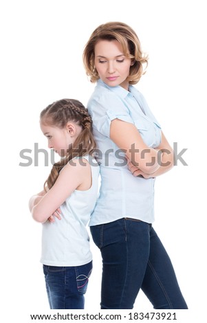 Sad mother and daughter having problem or quarrel standing back to back studio isolated on white