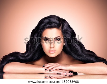 Portrait of a beautiful indian woman with long hairs over art creative background