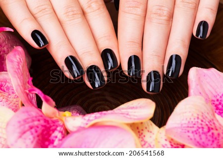 Beautiful women hands with black manicure after Spa procedures - Spa treatment concept