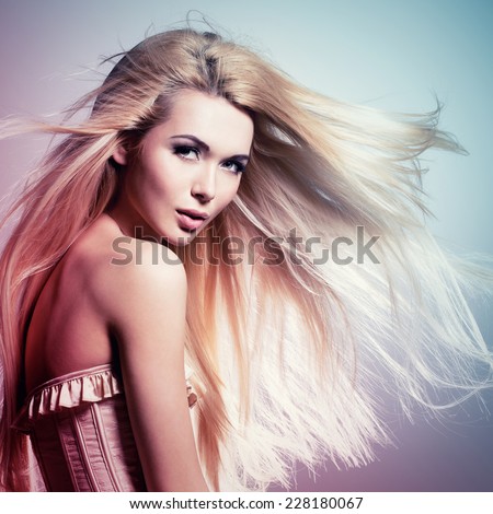 Portrait of the beautiful sexy woman with long blonde hair. Concept image is in tinting colorize style