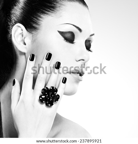 Beautiful  woman with black nails posing at studio