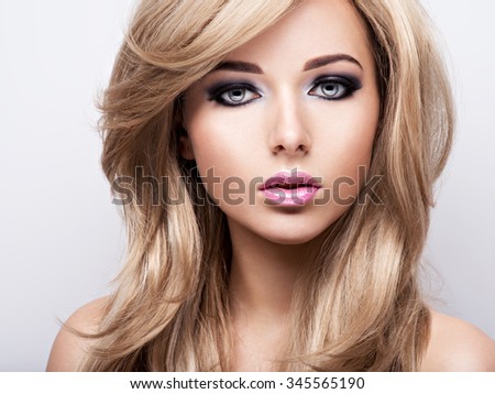 Portrait of pretty attractive young woman with bright makeup. Beautiful  brown-haired.