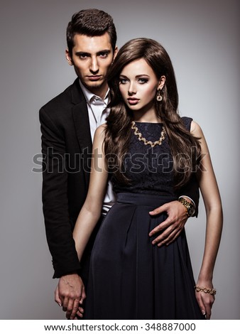 Studio portrait of young beautiful couple in love
