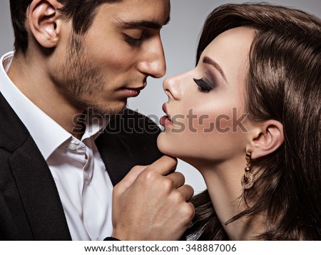portrait of young beautiful flirting couple in love. close-up