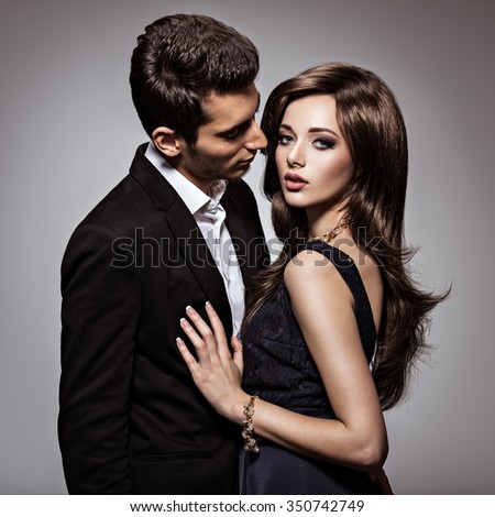 Studio portrait of young beautiful flirting  couple in love