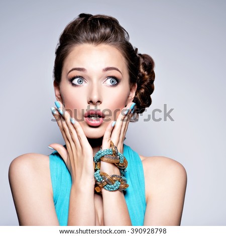 Beautiful girl with expressive emotions. Young woman with surprised face