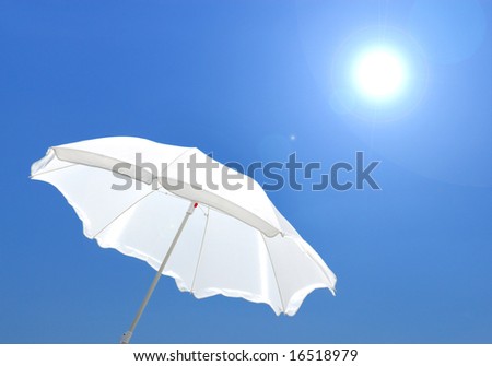 white sunshade on  background of the blue sky