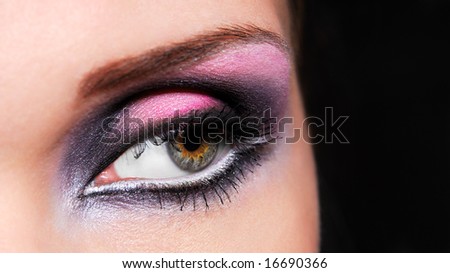 Multicolored ceremonial make-up of human eyes