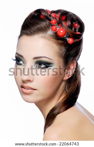 Profile portrait of a attractive young woman with creativity hairstyle and stylish make-up