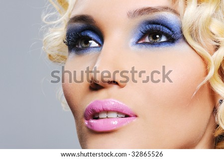 bright shine glamour make-up on the young beautiful female face