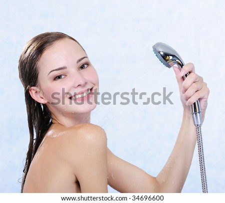 stock photo Beautiful attractive happy naked girl taking shower