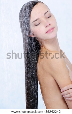 stock photo profile of beautiful girl taking shower closeup portrait
