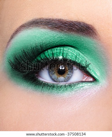 green eyeshadow makeup. eye with a green eyeshadow