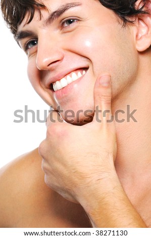 stock photo Closeup portrait of cleanshaven male face with a toothy
