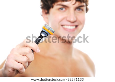 stock photo Happy laughing cleanshaven face of young man with razor in 