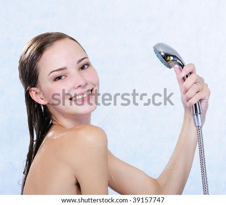 stock photo Beautiful attractive happy naked girl taking shower