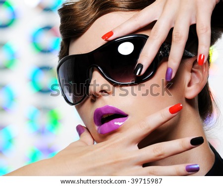     '' . . {   .. Stock-photo-woman-with-multicolored-manicure-and-fashion-stylish-sunglasses-39715987