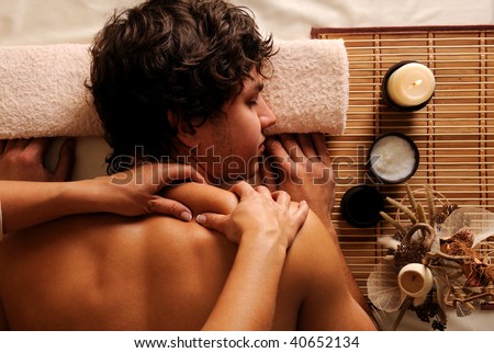 The young Man on spa treatment - recreation,  rest,  relaxation and massage. High angle view