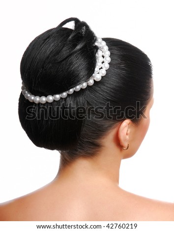 stock photo Rear view of a stylish modern wedding hairstyle with pearls 