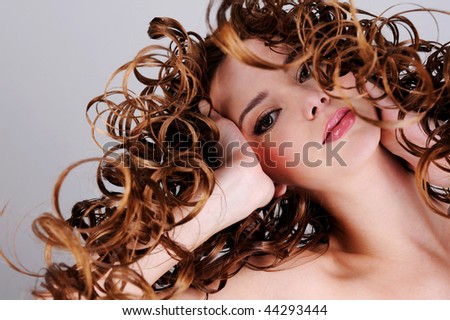 Attractive young woman with beauty long  hairs - low angle