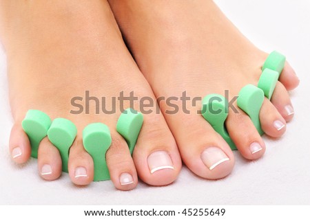 stock photo Beauty treatment photo of nice feet applying pedicure
