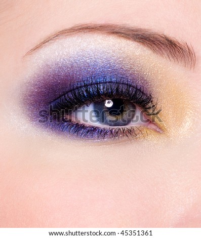 Modern Multicolored fashion makeup of a female eye - macro shot