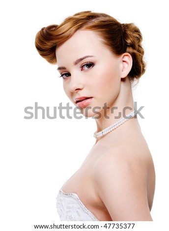 stock photo Young Beautiful bride with modern wedding hairstyle on white 
