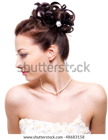 stock photo Profile portrait of a beautiful bride with wedding hairstyle 