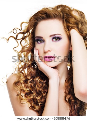 stock photo Young beautiful woman with long curly hairs isolated on