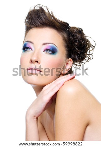 Beautiful woman face with bright makeup and creative hairstyle