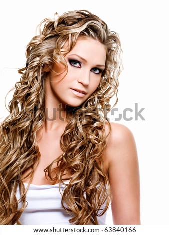 Beautiful woman with luxury blond long curly hair