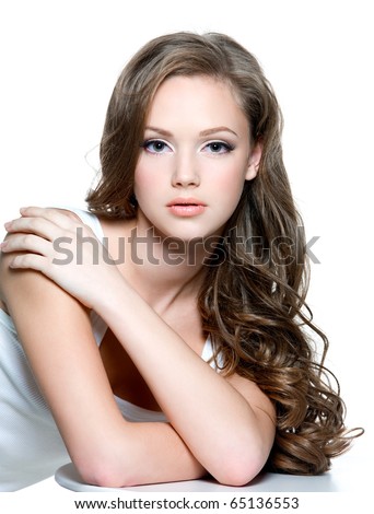 stock photo Portrait of a beautiful teen girl with long curly hairs and