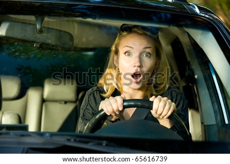 Fright face of  woman driving car and strongly squeeze the wheel