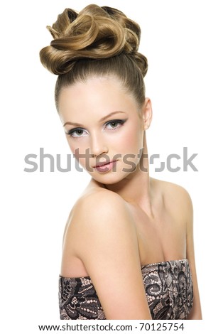 Beautiful teen girl with curly hairstyle and bright makeup - on white background