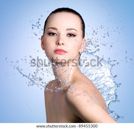Sensuality young woman with beautiful fresh skin in splashes of water
