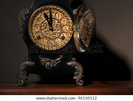 Antique clock open for adjusting