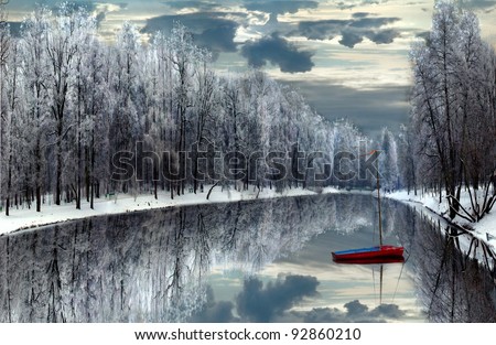 boat on winter lake/winter memories/boat on lake at City Park Lodz,Poland