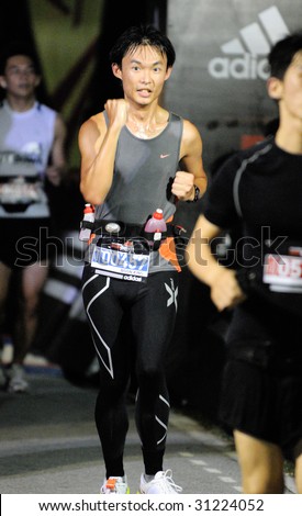 SINGAPORE - 31 May: Fist pump by ultra marathoner finisher at the Adidas Sundown Marathon held in Singapore on 30 and 31 May 2009.