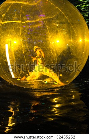 SINGAPORE - JUNE 19: Dance performance in giant plastic bubble floating on river surface at the Singapore River Festival held on 19 Jun 2009, in Singapore.