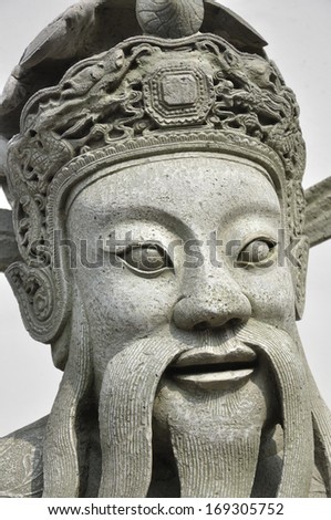 Head shot of Old Chinese man statue in wat Po, Thailand