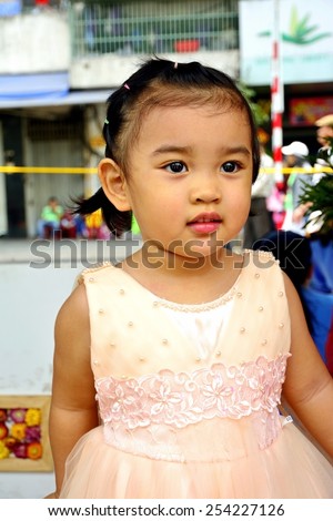 Portrait of south east Asia a little girl. Half Thai half Vietnamese. during Lunar new year festival in Ho Chi Minh City,Vietnam