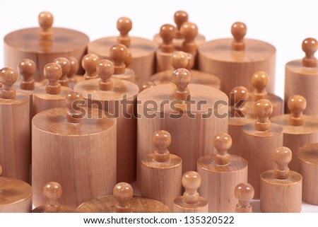 Montessori educational material: wooden cylinders