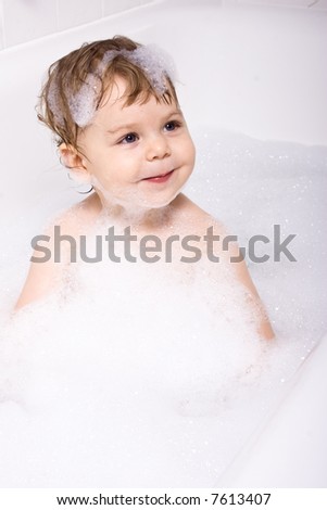 Baby in Bath with Soap Foam.