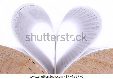sheet the paper of the book form a heart shape with white background