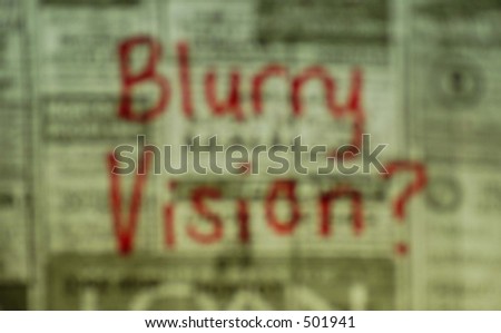 Blurry vision written on newspaper