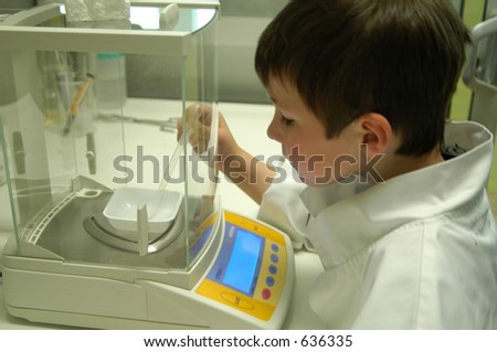 young scientist weighing on balance