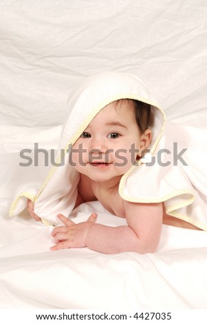 cute baby wrapped in bath towel