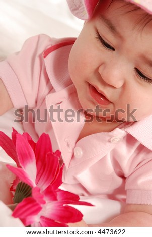 cute baby girl with pink flower